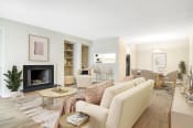Thumbnail 2 of 16 - Affinitee at Stone Mountain Apartments photo of a living room with a couch and a fireplace