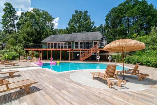 Affinitee at Stone Mountain Apartments photo of a swimming pool and a deck with chairs
