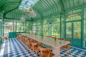 Thumbnail 7 of 16 - Affinitee at Stone Mountain Apartments photo of the pavillon with a long table and chairs